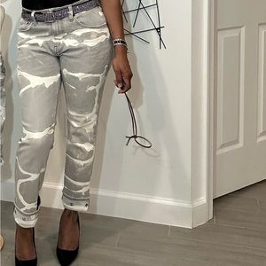 Custom bleached painted riveted jeans